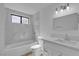 Bathroom featuring a new toilet, vanity with sink, bathtub and tiled shower at 2108 Plaza Del Dios, Las Vegas, NV 89102