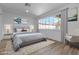 Comfortable bedroom with a plush bed, large window, and soft, neutral tones at 2108 Plaza Del Dios, Las Vegas, NV 89102