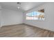 Bright bedroom featuring wood-look floors, a large window, and white trim at 2108 Plaza Del Dios, Las Vegas, NV 89102