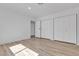 Bedroom featuring wood-look floors and a double closet with white trim at 2108 Plaza Del Dios, Las Vegas, NV 89102