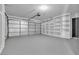 Garage with insulated door, utility door, built-in shelves, and an automatic garage door opener at 2108 Plaza Del Dios, Las Vegas, NV 89102