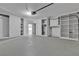 Garage with utility door, built-in shelves, and an automatic garage door opener at 2108 Plaza Del Dios, Las Vegas, NV 89102