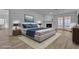Inviting main bedroom featuring a fireplace, neutral tones, and access to the backyard at 2108 Plaza Del Dios, Las Vegas, NV 89102