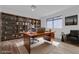 Well-appointed home office with built-in shelving, large desk, and natural light at 2108 Plaza Del Dios, Las Vegas, NV 89102