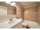 Updated bathroom with a single sink vanity, quartz countertop, and a tiled shower-tub combo for a modern aesthetic at 2110 Bavington Dr # C, Las Vegas, NV 89108