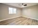 Inviting bedroom with wood floors and natural light streaming through the window, creating a warm atmosphere at 2110 Bavington Dr # C, Las Vegas, NV 89108