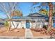 Charming single-story home featuring a blue tiled roof and a well-maintained front yard at 2110 Bavington Dr # C, Las Vegas, NV 89108