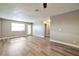Open concept living space with access to patio and modern vinyl plank flooring at 2110 Bavington Dr # C, Las Vegas, NV 89108