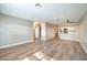 Open concept living space with updated kitchen and modern vinyl plank flooring at 2110 Bavington Dr # C, Las Vegas, NV 89108