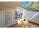 Private courtyard with a security door and a charming window at 2110 Bavington Dr # C, Las Vegas, NV 89108