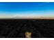 Aerial view of a neighborhood with a mountain range on the horizon under a clear blue sky at 2204 Ambermill Ct, Henderson, NV 89052