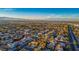 Expansive aerial view of a residential community with a city skyline and mountain backdrop at 2204 Ambermill Ct, Henderson, NV 89052