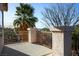 Balcony features sturdy stone columns, decorative railings, and views of mature trees at 2204 Ambermill Ct, Henderson, NV 89052