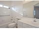Well-lit bathroom includes a tub with shower, vanity sink, and modern fixtures at 2204 Ambermill Ct, Henderson, NV 89052