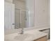 Bathroom featuring a large mirror, a white sink, and a glass-enclosed shower at 2204 Ambermill Ct, Henderson, NV 89052