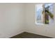 Cozy bedroom with carpet flooring and a window overlooking lush greenery at 2204 Ambermill Ct, Henderson, NV 89052