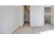 Clean bedroom featuring neutral carpet, a closet, and a view into the next room at 2204 Ambermill Ct, Henderson, NV 89052