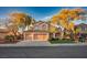 Charming two-story home with a three car garage, mature trees, and well-maintained landscaping at 2204 Ambermill Ct, Henderson, NV 89052