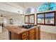 Open-concept kitchen with a large island, gas cooktop, and views to the living area at 2204 Ambermill Ct, Henderson, NV 89052