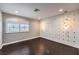 Bedroom with a decorative wall and large window featuring shutters at 2340 Hunt Club St, Las Vegas, NV 89128