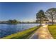 Scenic view of the lake and walking path, showcasing the community's natural beauty at 2340 Hunt Club St, Las Vegas, NV 89128