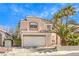 Charming two-story home with tile roof, desert landscaping, and a two-car garage in a sunny setting at 2340 Hunt Club St, Las Vegas, NV 89128