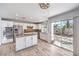 Stylish kitchen with white cabinetry, granite countertops, stainless steel appliances, and modern lighting at 2340 Hunt Club St, Las Vegas, NV 89128