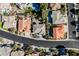 A high-angle captures several houses, including the gray roofed house, on a sunny street at 2493 Ram Crossing Way, Henderson, NV 89074
