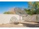 Enclosed backyard featuring satellite dish and neutral tones in the desert landscape at 2493 Ram Crossing Way, Henderson, NV 89074
