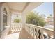 A balcony featuring white columns and a railing, offering an inviting outdoor space at 2493 Ram Crossing Way, Henderson, NV 89074
