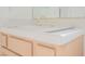 Bathroom sink and vanity with decorative white tile and gold fixtures at 2493 Ram Crossing Way, Henderson, NV 89074