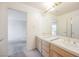 Bathroom features double sinks, a large mirror, and a doorway to another area at 2493 Ram Crossing Way, Henderson, NV 89074