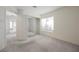 This bedroom features neutral carpet, sliding mirror closet doors and a bright window at 2493 Ram Crossing Way, Henderson, NV 89074