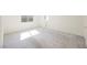 Bedroom featuring a window, access to a bathroom, and carpet flooring throughout at 2493 Ram Crossing Way, Henderson, NV 89074