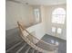 A view of the entryway from the top of the staircase with beautiful windows at 2493 Ram Crossing Way, Henderson, NV 89074