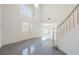 Bright entryway with tile floors, staircase, and a soaring ceiling height at 2493 Ram Crossing Way, Henderson, NV 89074