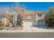 Charming two-story home with tile roof, three-car garage, and manicured landscaping at 2493 Ram Crossing Way, Henderson, NV 89074