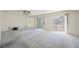 Spacious living room with carpet, projector, and sliding doors to the outside at 2493 Ram Crossing Way, Henderson, NV 89074