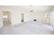 Spacious living room with carpet, projector, and sliding doors to the outside at 2493 Ram Crossing Way, Henderson, NV 89074