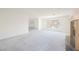 Bright living room featuring a fireplace, large window, and carpet at 2493 Ram Crossing Way, Henderson, NV 89074