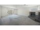Spacious living room featuring a fireplace and sliding door access to a balcony at 2493 Ram Crossing Way, Henderson, NV 89074