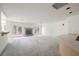 Open living room featuring a fireplace, access to the backyard, and neutral paint at 2493 Ram Crossing Way, Henderson, NV 89074