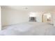 Open living room with fireplace and view into another room at 2493 Ram Crossing Way, Henderson, NV 89074
