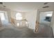 Loft area with views of the living room and fireplace at 2493 Ram Crossing Way, Henderson, NV 89074