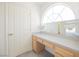 Bathroom vanity area with large mirror and natural light at 2493 Ram Crossing Way, Henderson, NV 89074