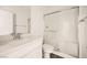 Bathroom features a modern glass-enclosed shower, single sink vanity, and wood look tile floors at 3004 Moulin Heights St, Las Vegas, NV 89156