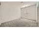 A secondary bedroom featuring gray carpet and a window for natural light at 3004 Moulin Heights St, Las Vegas, NV 89156