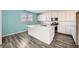 Modern kitchen boasts a center island, stainless steel appliances, and ample cabinet space at 3004 Moulin Heights St, Las Vegas, NV 89156