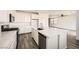 Contemporary kitchen featuring white cabinets, quartz countertops, and stainless steel appliances at 3004 Moulin Heights St, Las Vegas, NV 89156