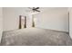 Expansive main bedroom with neutral carpeting and a ceiling fan at 3004 Moulin Heights St, Las Vegas, NV 89156